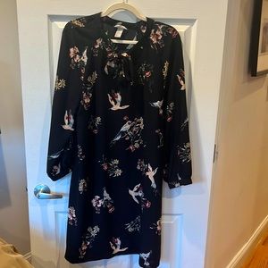 Long sleeve black dress with birds and flowers.
